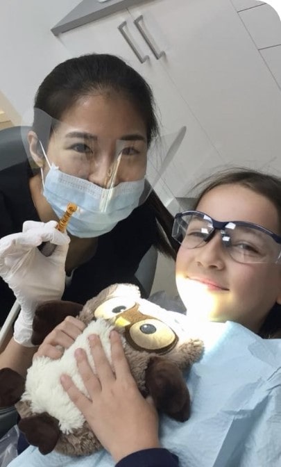 Pediatric dentist Dr. Kim Tracy with the patient